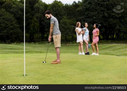 adult fit man training golf outdoors