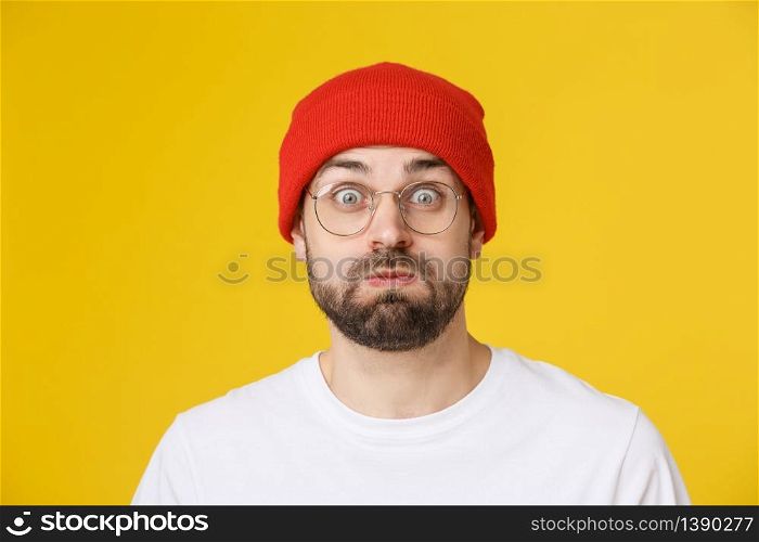 Adult hispanic man over isolated background depressed and worry for distress, angry and afraid. Sad expression.. Adult hispanic man over isolated background depressed and worry for distress, angry and afraid. Sad expression