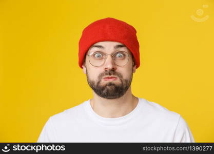 Adult hispanic man over isolated background depressed and worry for distress, angry and afraid. Sad expression.. Adult hispanic man over isolated background depressed and worry for distress, angry and afraid. Sad expression