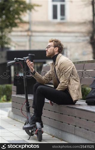 adult male enjoying coffee outdoors
