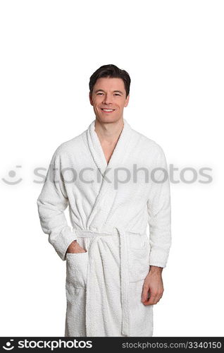 Adult man in bathrobe standing on white background