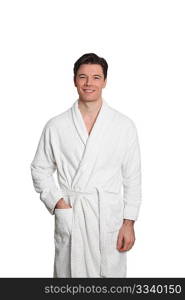 Adult man in bathrobe standing on white background
