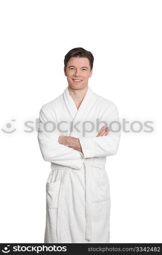 Adult man in bathrobe standing on white background