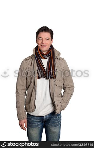 Adult man with winter clothes standing on white background