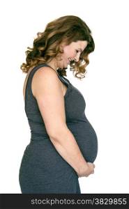 adult pregnant woman holding her hands on her belly