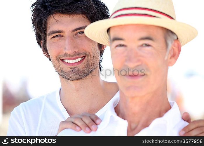 Adult son and father on holiday