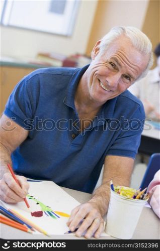 Adult student in class drawing picture