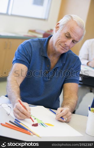 Adult student in class drawing picture