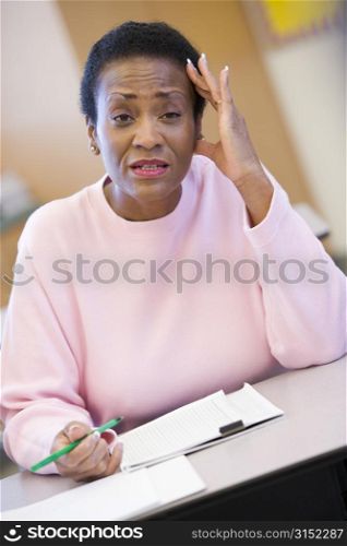 Adult student in class looking frustrated