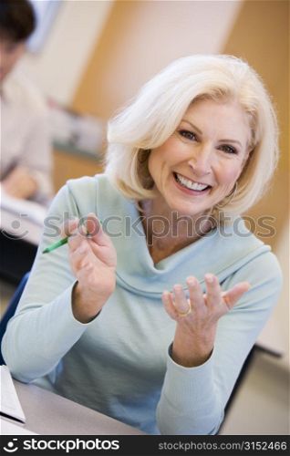Adult student in class smiling (selective focus)