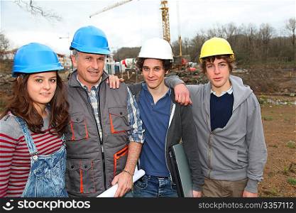 Adult with group of teenagers in professional training