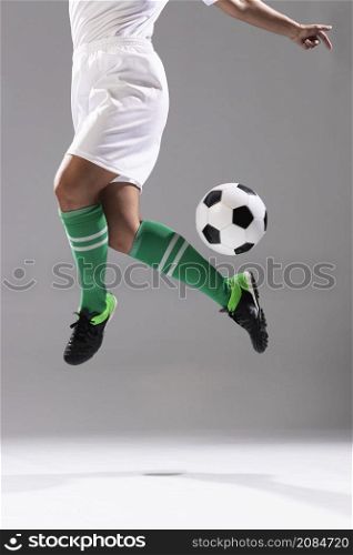 adult woman doing tricks with soccer ball