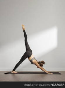 adult woman doing yoga home