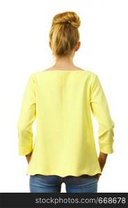 Adult woman presenting her casual beautiful outfit, long sleeved yellow top from back.. Woman wearing casual outfit