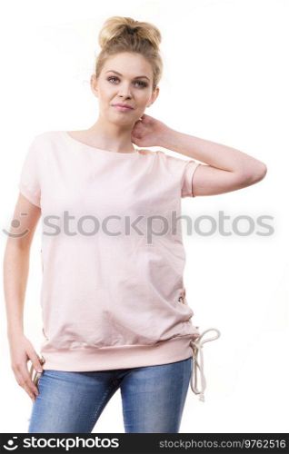 Adult woman presenting her casual beautiful outfit, short sleeved pink top and jeans.. Woman wearing casual outfit