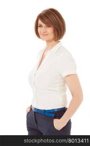 Adult woman smiling while standing against of white background. Hands in pockets.Isolated. White background.. Smiling adult woman looking away