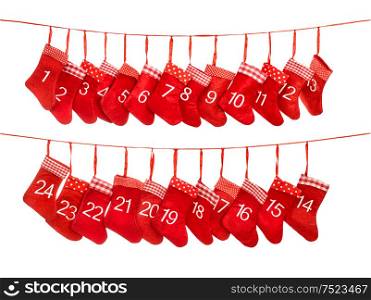 Advent calendar 1-24. Red christmas stocking gift bags isolated on white background. Holidays decoration