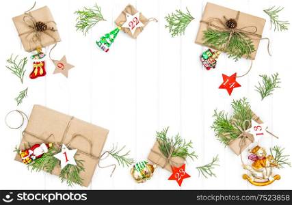 Advent calendar on bright wooden background. Christmas gifts, ornaments and decorations
