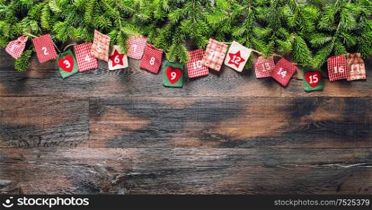 Advent calendar with Christmas gifts on dark wooden background