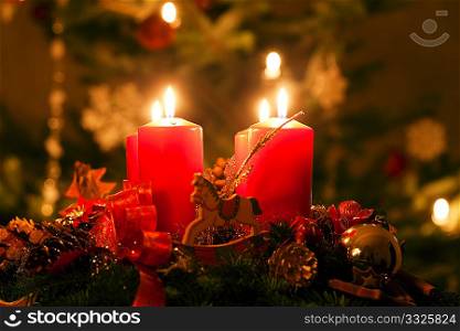 Advent wreath illuminated by candlelight