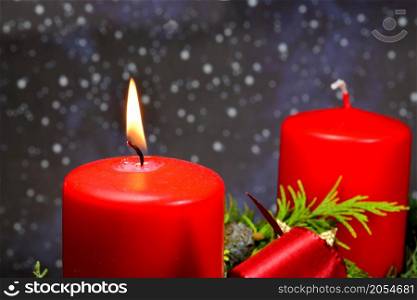 advent wreath with burning candle