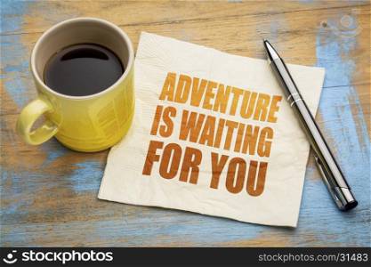 Adventure is waiting for you - text on a napkin with a cup of espresso coffee