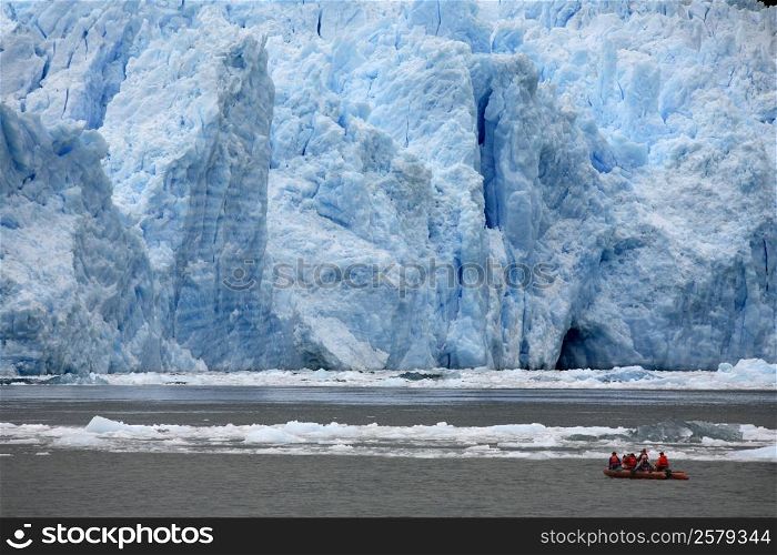 Adventure Tourism. Tourists in a zodiac view the terminus of the San Rafael Glacier in Patagonia in southern Chile in South America.