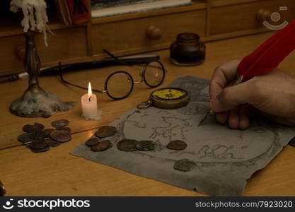 Adventurer drawing a map in search of a lost treasure