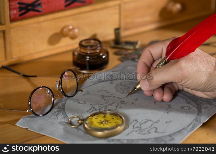 Adventurer drawing a map in search of a lost treasure