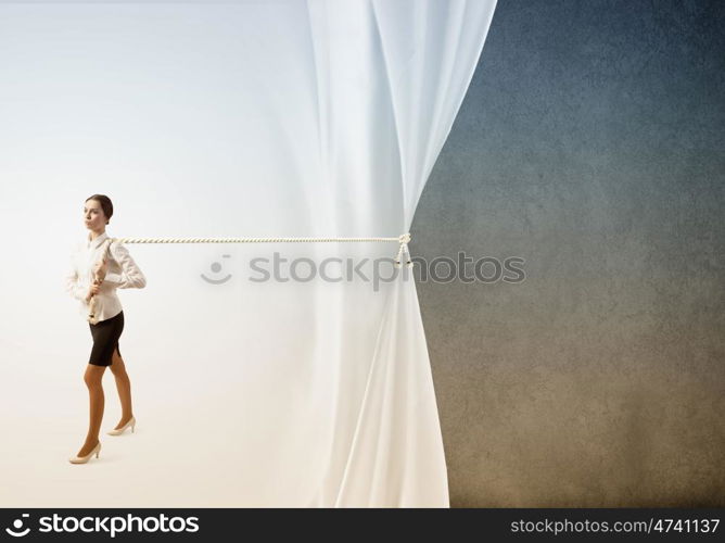 Advertise concept. Young businesswoman pulling curtain with rope. Place for text