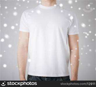 advertisement and design concept - man in blank t-shirt