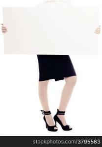 Advertisement. Blank copy space banner in female hands and sexy legs isolated on white. Businesswoman recommending your product