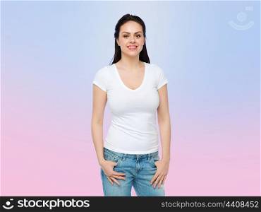 advertisement, clothing and people concept - happy smiling young woman or teenage girl in white t-shirt over rose quartz and serenity gradient background