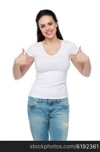 advertisement, clothing and people concept - happy smiling young woman or teenage girl in white t-shirt pointing finger to herself