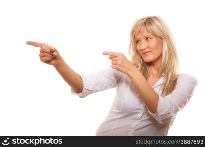 Advertisement concept - mature business woman pointing with finger showing blank copy space isolated on white background