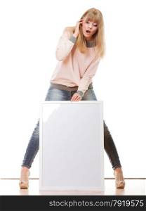 Advertisement concept. woman emotional face expression full body with blank presentation board. Female model showing banner sign copy space. Isolated