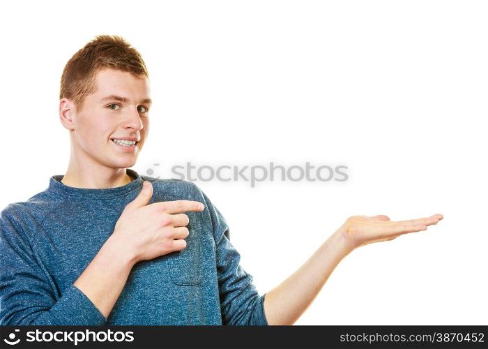 advertisement concept. Young man holding open palm empty hand showing copy space for product isolated on white background