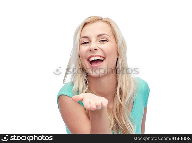 advertisement, emotions and people concept - smiling young woman or teenage girl holding something on hand