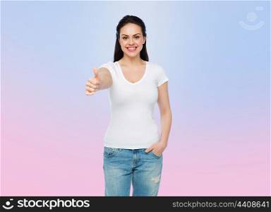 advertisement, gesture, clothing and people concept - happy smiling young woman or teenage girl in white t-shirt showing thumbs up over rose quartz and serenity gradient background