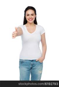 advertisement, gesture, clothing and people concept - happy smiling young woman or teenage girl in white t-shirt showing thumbs up