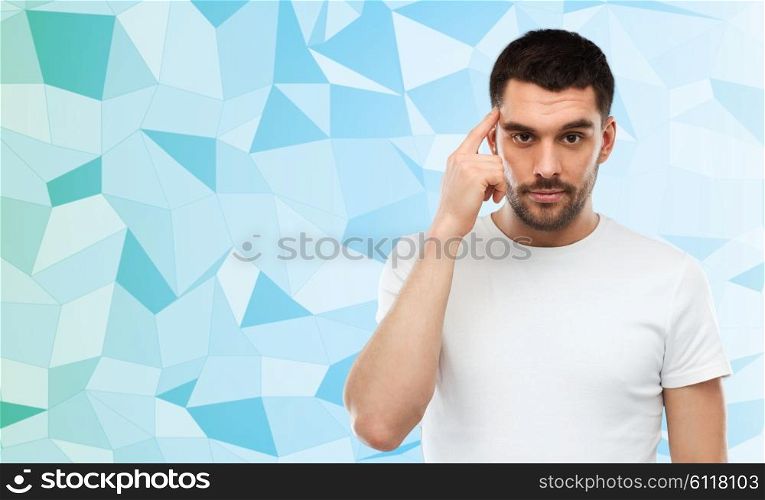 advertisement, idea, inspiration and people concept - man pointing finger to his temple over blue low poly background