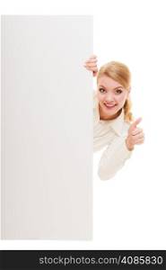Advertisement. Woman hiding behind blank copy space banner showing thumb up isolated. Businesswoman recommending product