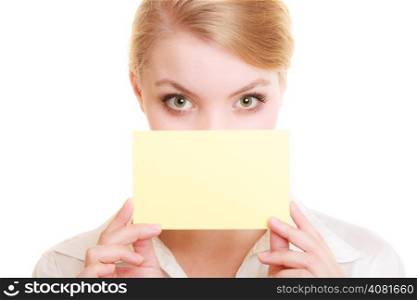Advertisement. Young woman covering face with blank copy space yellow business card isolated on white. Businesswoman recommending product