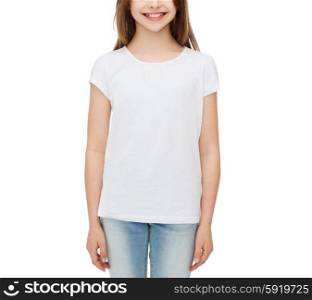advertising and t-shirt design concept - smiling little girl in white blank t-shirt over white background. smiling little girl in white blank t-shirt