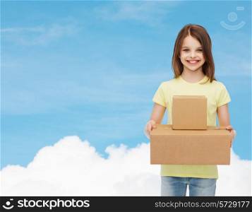 advertising, childhood, delivery, mail and people - smiling little girl holding cardboard boxes over blue background
