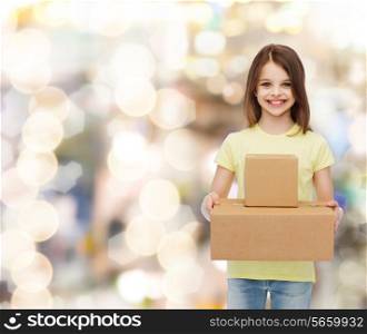 advertising, childhood, delivery, mail and people - smiling little girl holding cardboard boxes over holidays background