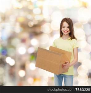 advertising, childhood, delivery, mail and people - smiling little girl holding open cardboard box over holidays background
