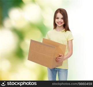 advertising, childhood, delivery, mail and people - smiling little girl holding open cardboard box over green background