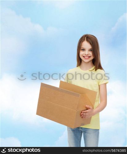 advertising, childhood, delivery, mail and people - smiling little girl holding open cardboard box over cloudy background