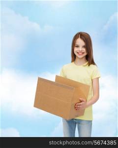 advertising, childhood, delivery, mail and people - smiling little girl holding open cardboard box over cloudy background